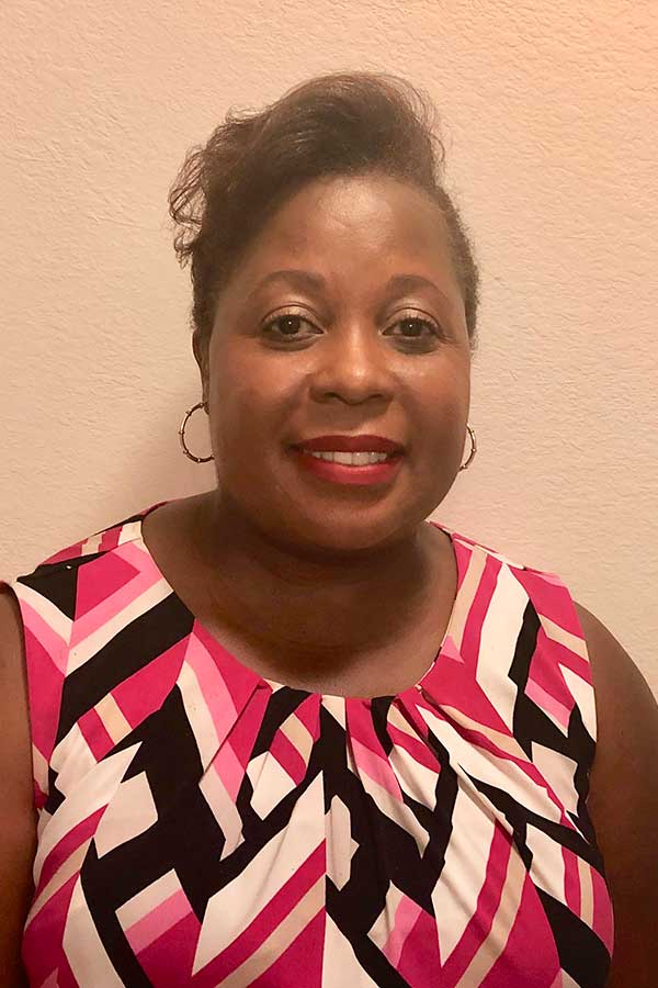 Dr. Tryphose Charles